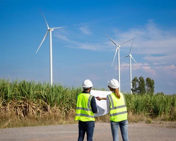Bigstock Engineer Team Working In Wind 473031945